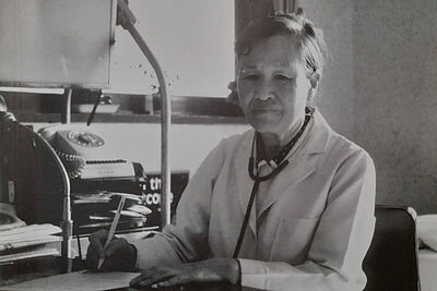 Korean woman at a desk.